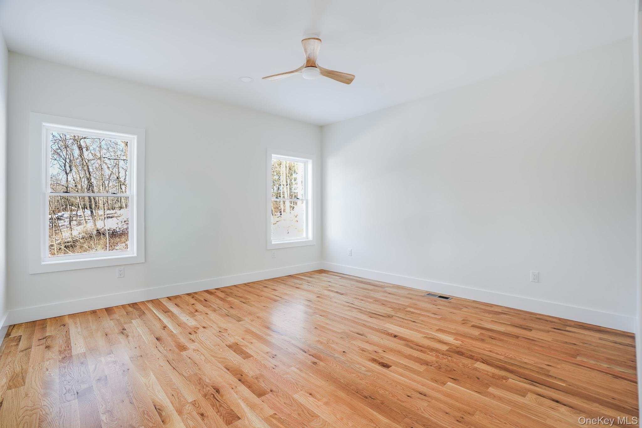 6 Roundhill Road Hopewell Junction, NY 12533 - Photo 17 of 23 wooden floor in an empty room with a window