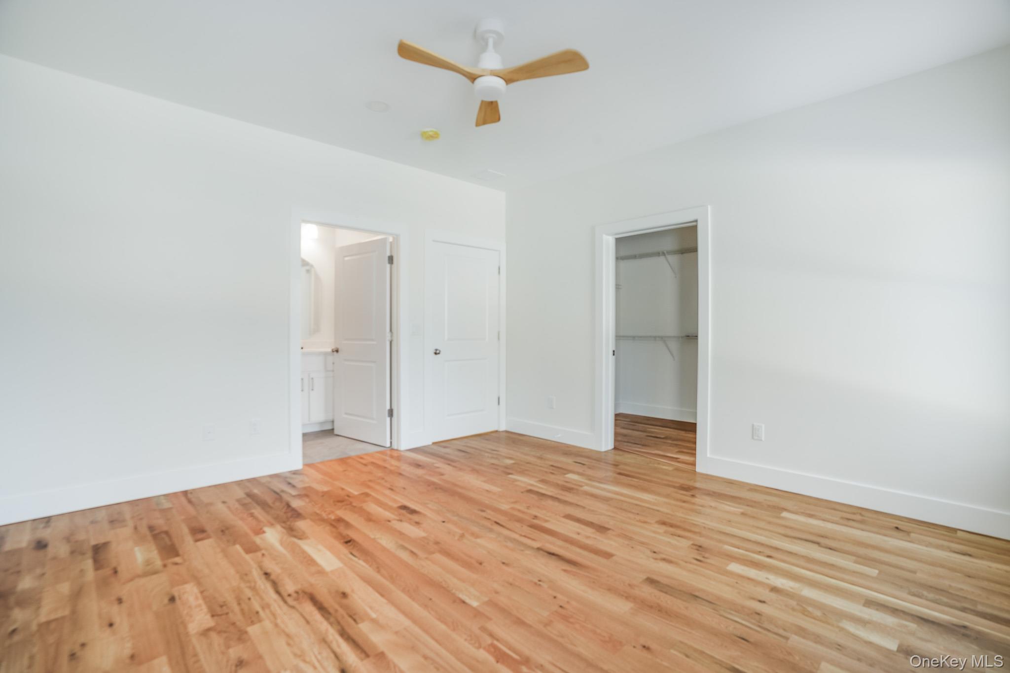 6 Roundhill Road Hopewell Junction, NY 12533 - Photo 18 of 23 a view of a big room with wooden floor and a ceiling fan