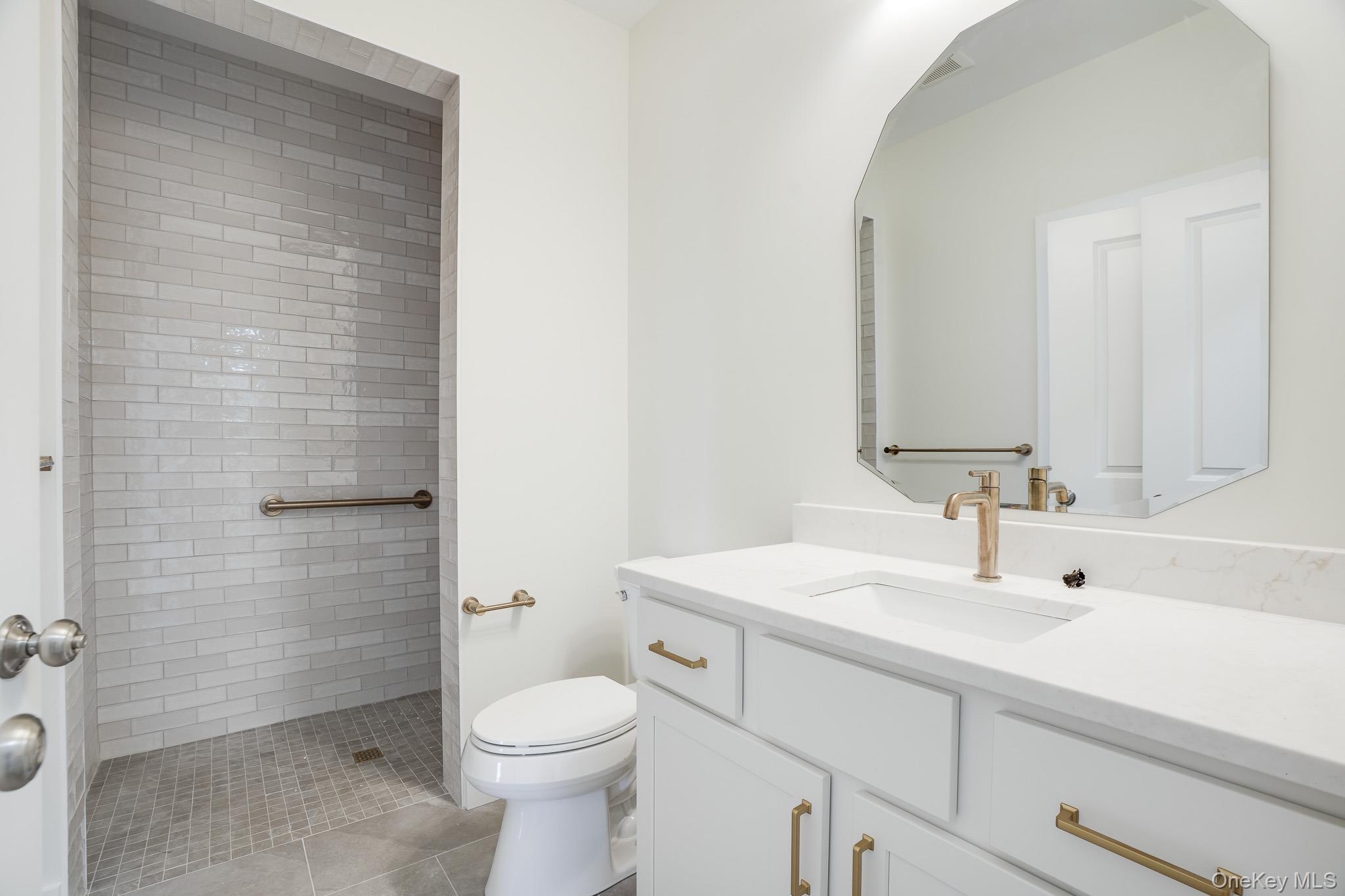 6 Roundhill Road Hopewell Junction, NY 12533 - Photo 19 of 23 a bathroom with a sink a toilet and shower