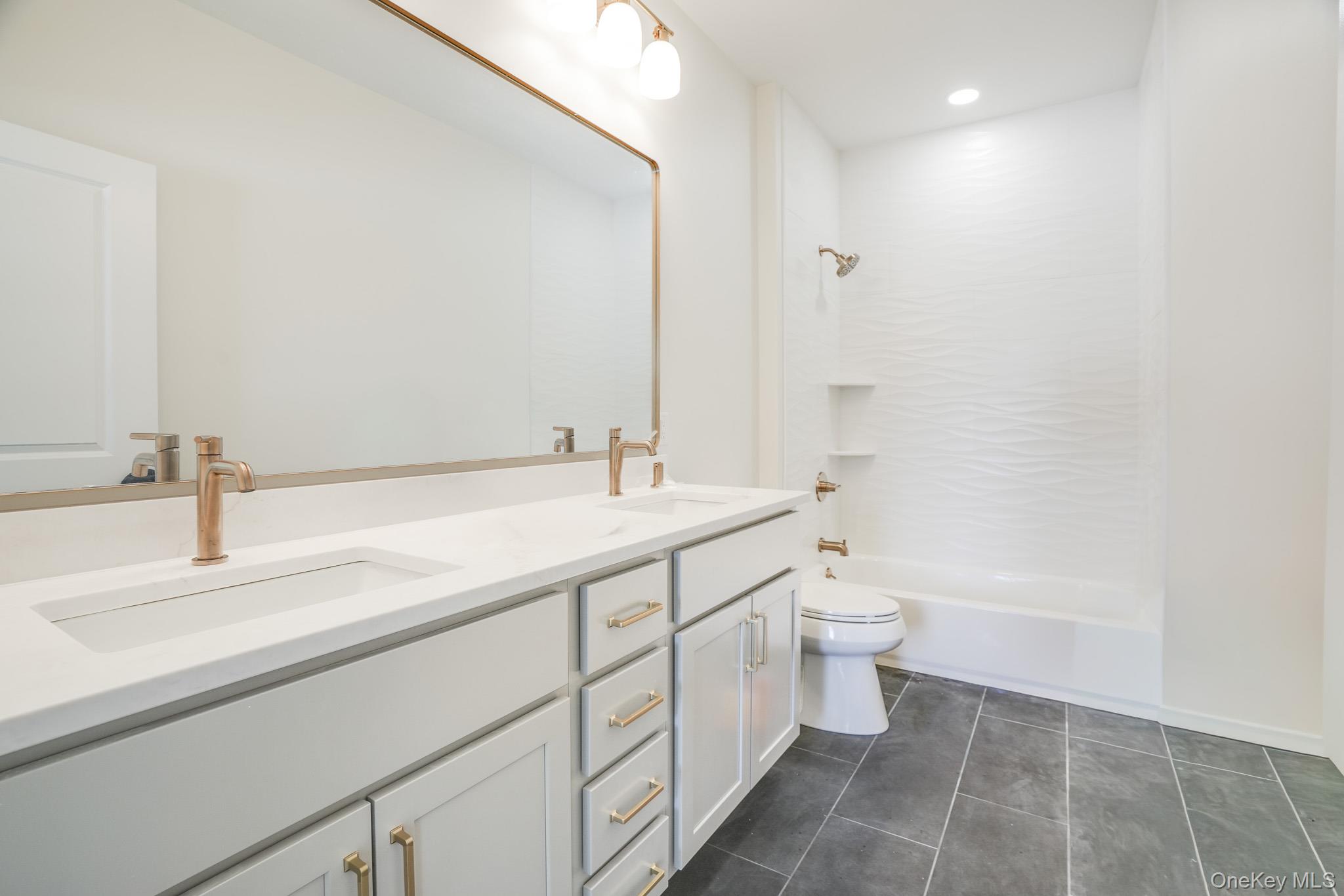6 Roundhill Road Hopewell Junction, NY 12533 - Photo 20 of 23 a bathroom with a double vanity sink and a toilet