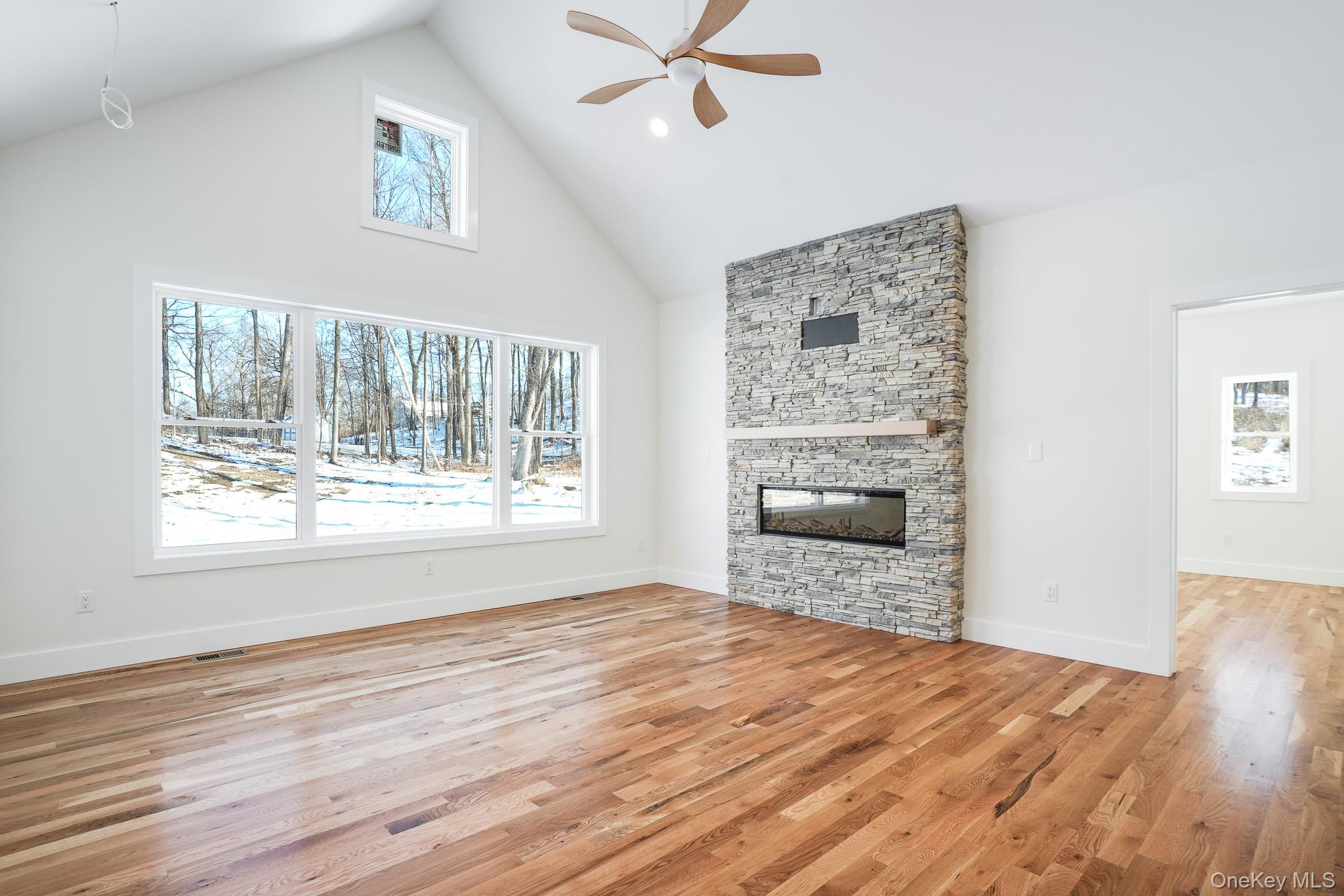 6 Roundhill Road Hopewell Junction, NY 12533 - Photo 5 of 23 a view of an empty room with a window and wooden floor