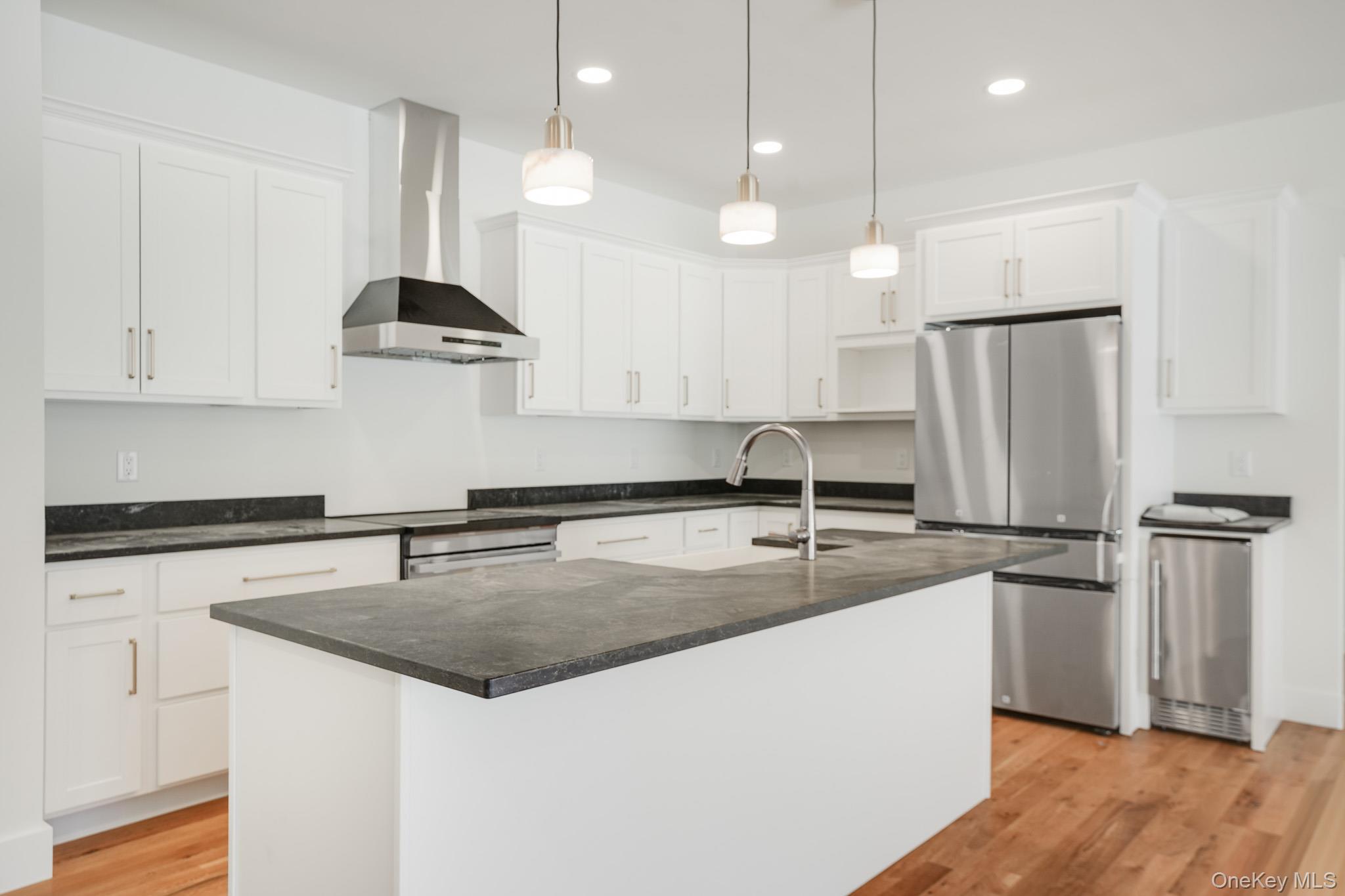 6 Roundhill Road Hopewell Junction, NY 12533 - Photo 7 of 23 a kitchen with stainless steel appliances granite countertop a sink a refrigerator and a stove