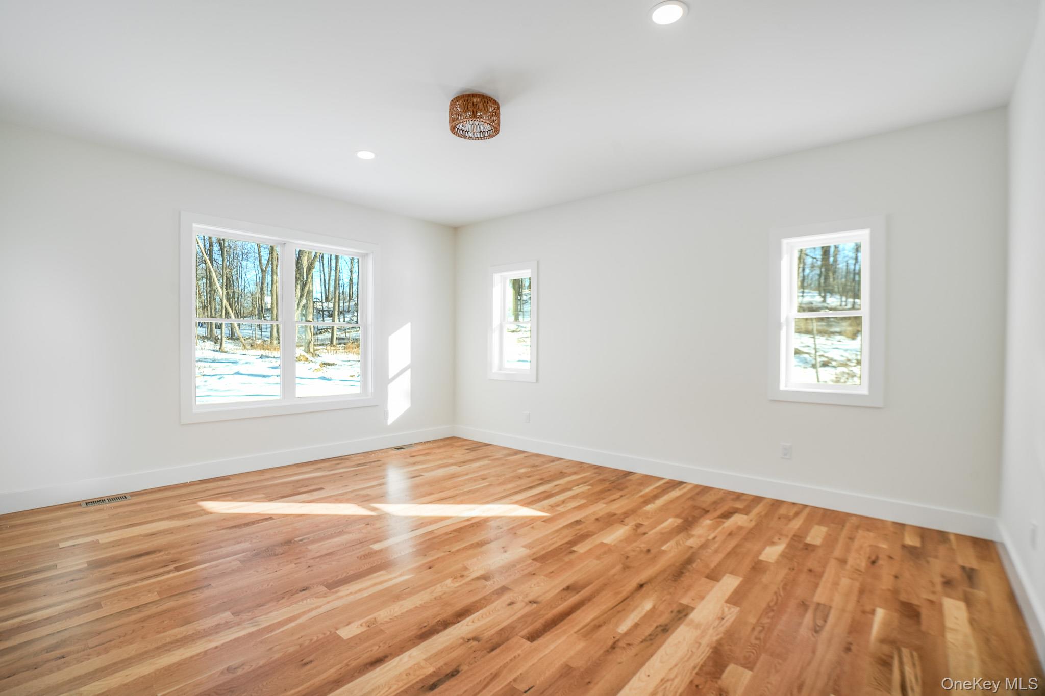 6 Roundhill Road Hopewell Junction, NY 12533 - Photo 8 of 23 a view of an empty room with wooden floor and a window