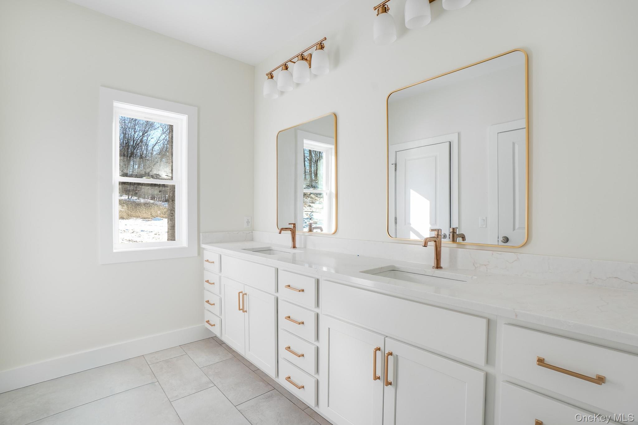 6 Roundhill Road Hopewell Junction, NY 12533 - Photo 10 of 23 a bathroom with double sink and a mirror