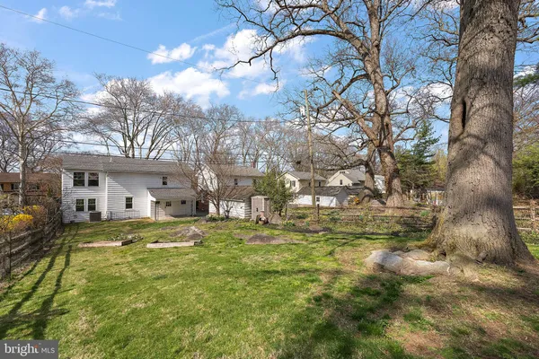a view of a house with a yard and porch