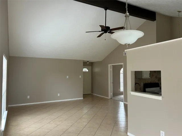 a view of a hallway with a room