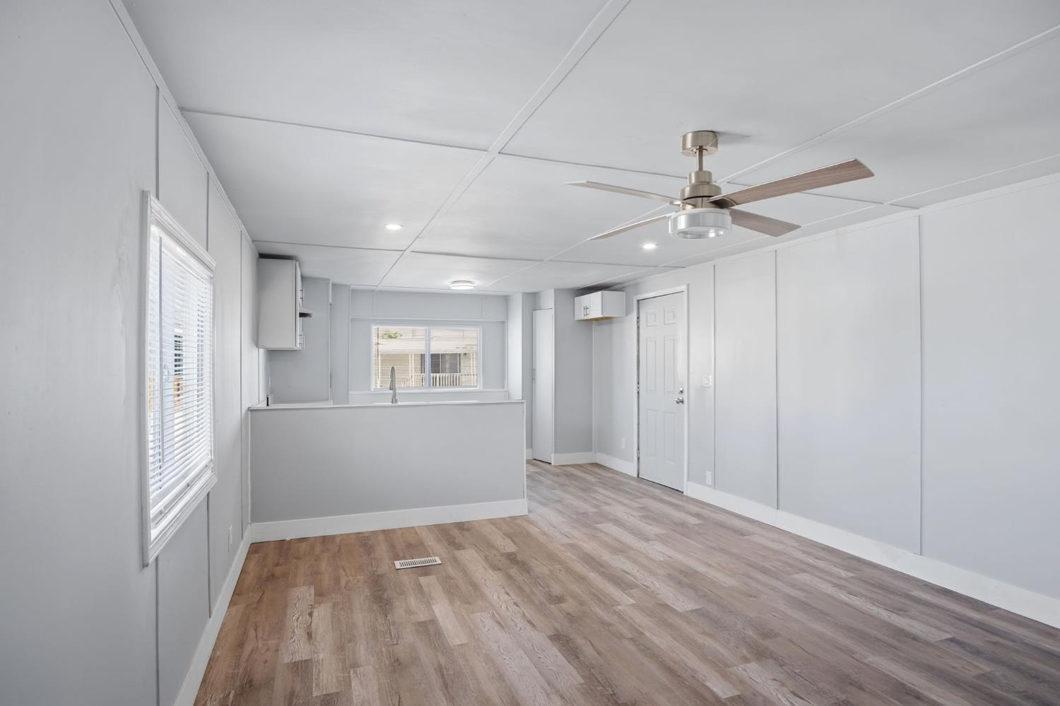 5508 Keith Court, Unit 19 Turlock, CA 95382 - Photo 6 of 13 a view of empty room with wooden floor