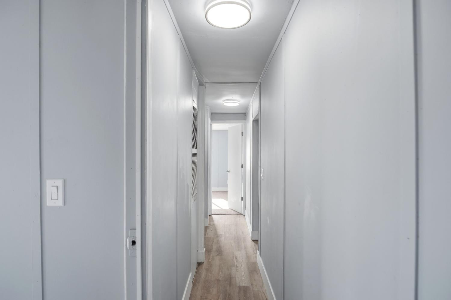 5508 Keith Court, Unit 19 Turlock, CA 95382 - Photo 7 of 13 a view of a hallway with wooden floor
