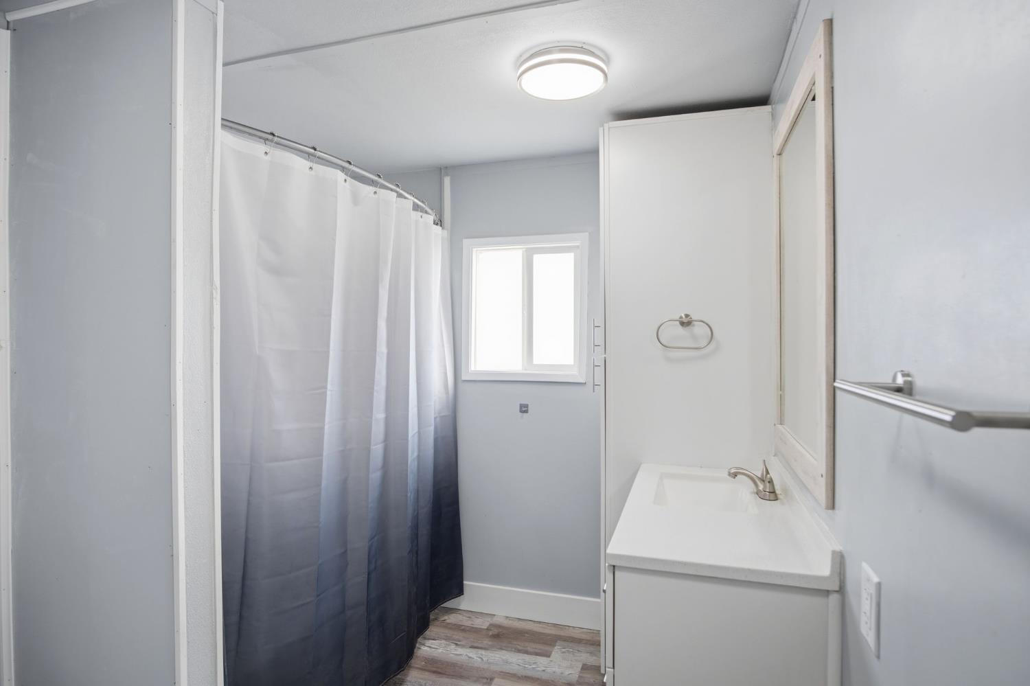 5508 Keith Court, Unit 19 Turlock, CA 95382 - Photo 10 of 13 a bathroom with a sink a toilet and shower