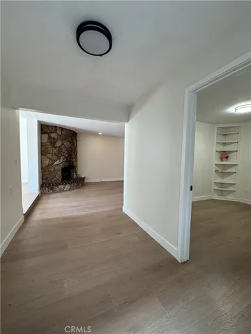 a view of a room with furniture and a window