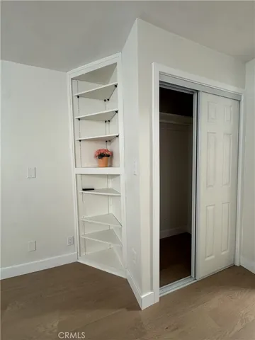 an empty room with shelves
