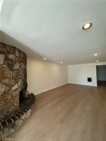 an empty room with a fireplace