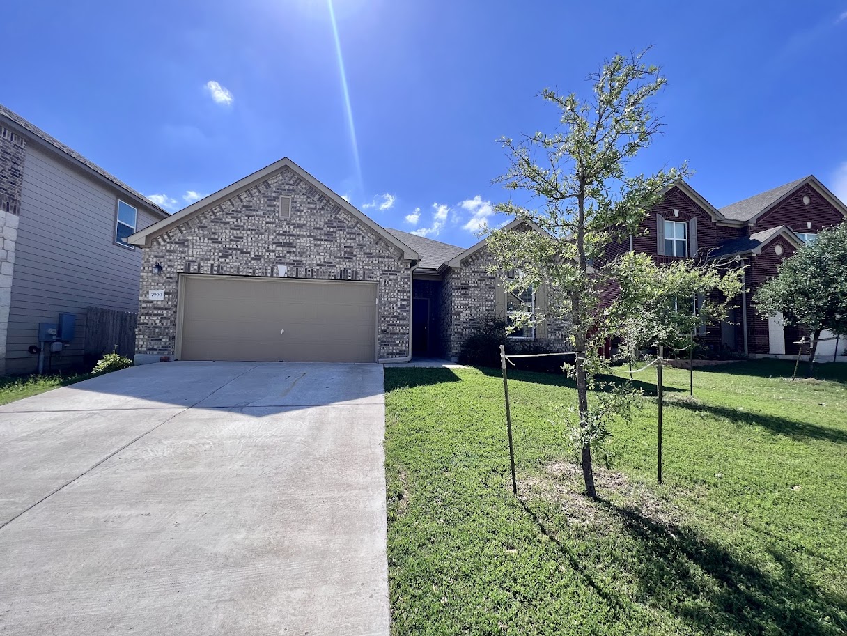 7900 Crystalbrook West Austin, TX 78724 - Photo 3 of 27 a view of a house with a yard and potted plants