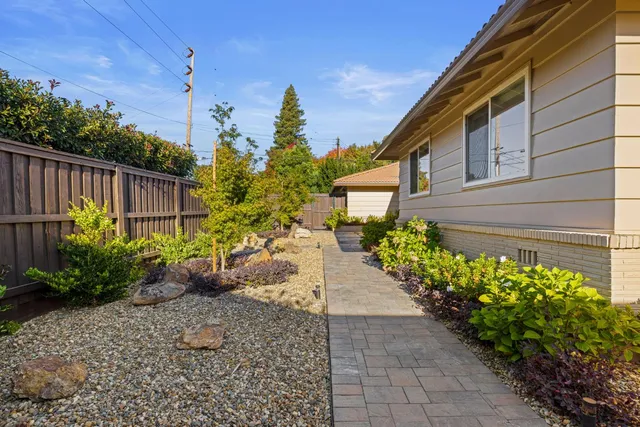 a kitchen with stainless steel appliances granite countertop a refrigerator stove and microwave