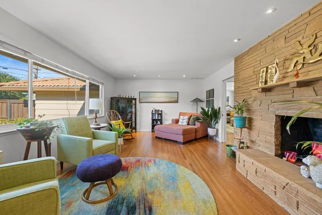 a kitchen with stainless steel appliances granite countertop a refrigerator stove microwave and sink