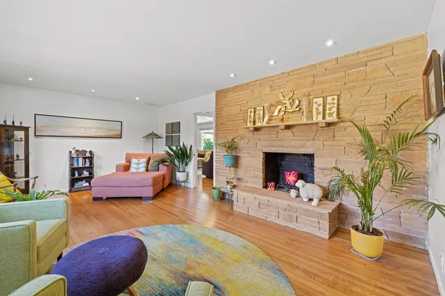 a dining room with furniture a rug and a chandelier