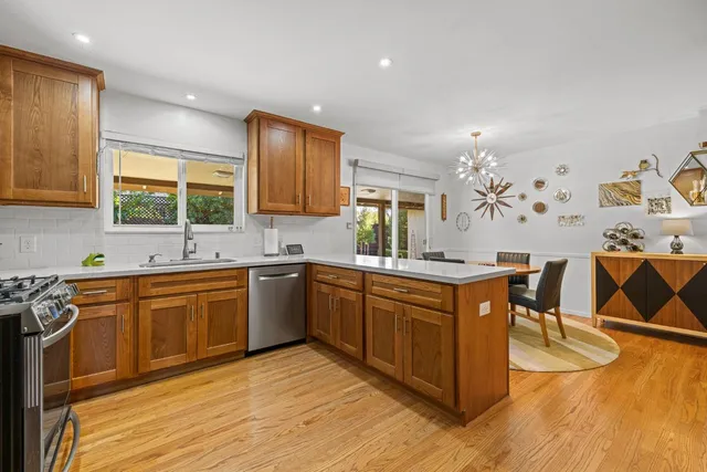 a bed room with a bed mirror and a table
