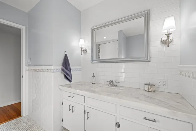 a front view of a house with a garden and patio