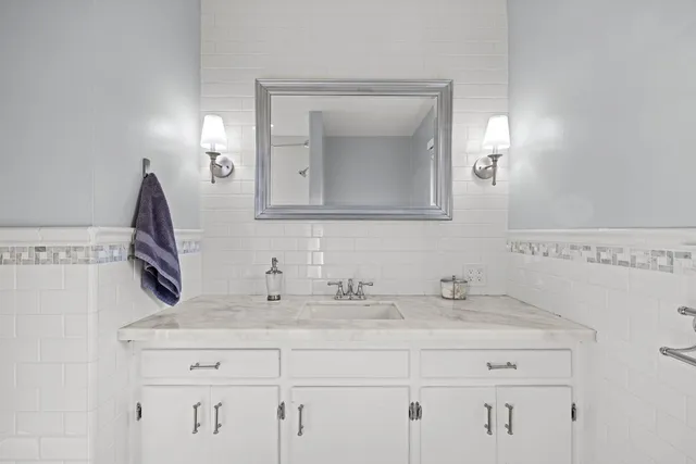 a backyard of a house with barbeque oven table and chairs