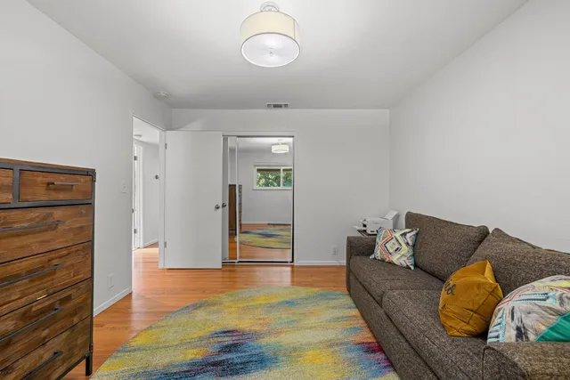 a view of a patio with a table and chairs