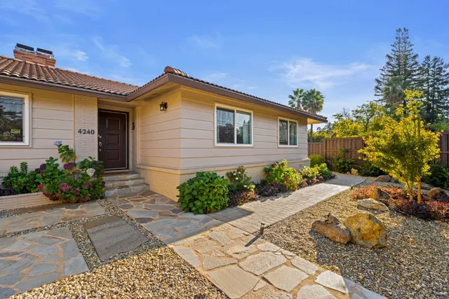 a view of a backyard with a patio