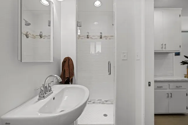 an aerial view of a house with a yard and lake view