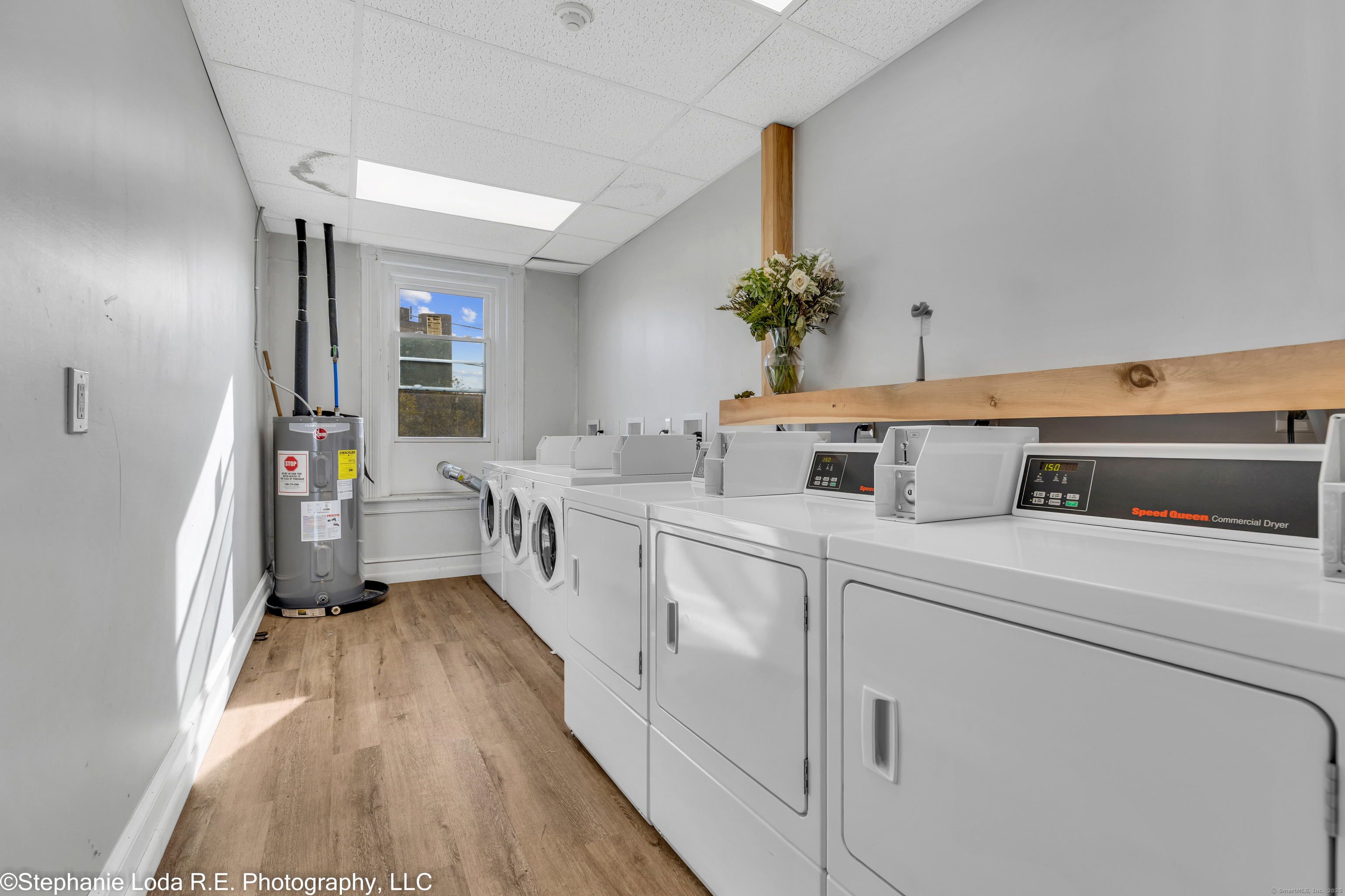 82 Water Street, Unit 2 Torrington, CT 06790 - Photo 17 of 20 a utility room with cabinets washer and dryer
