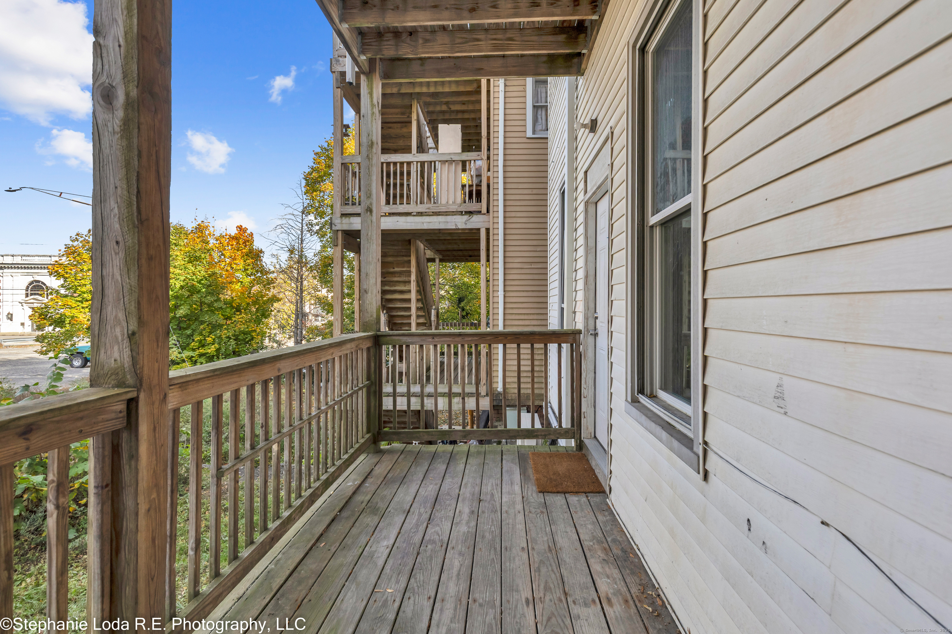 82 Water Street, Unit 2 Torrington, CT 06790 - Photo 18 of 20 a view of a balcony with wooden floor