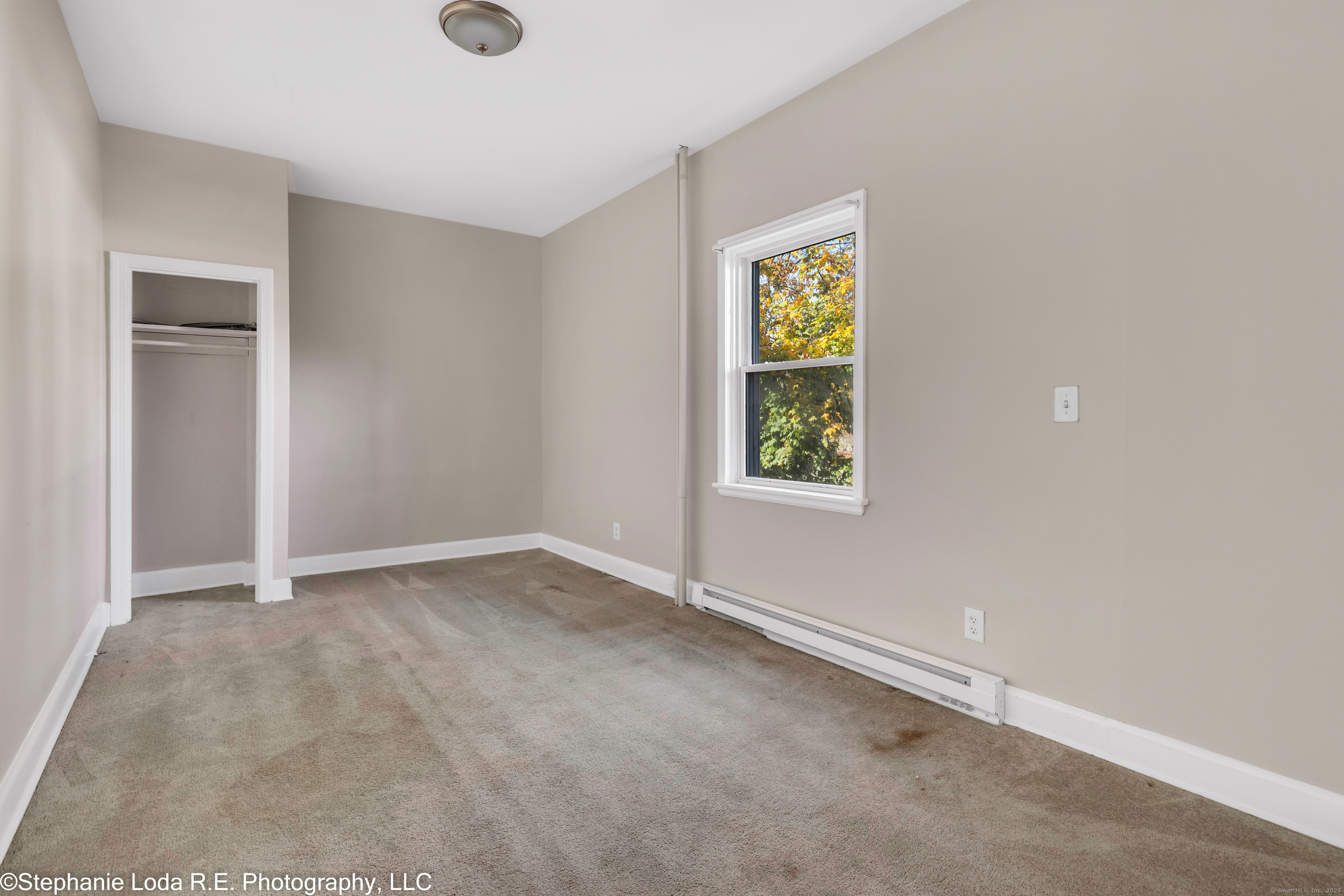 82 Water Street, Unit 2 Torrington, CT 06790 - Photo 7 of 20 an empty room with windows