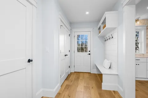 a view of hallway with wooden floor