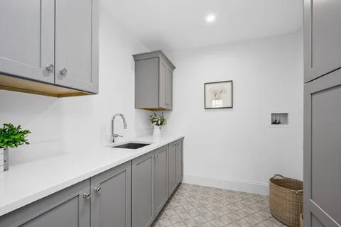 a kitchen with a sink and cabinets