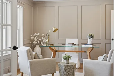 a dining room with furniture and a chandelier