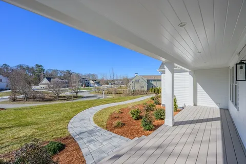 a view of a swimming pool with an outdoor seating