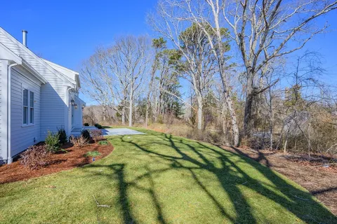 a view of backyard with swimming pool