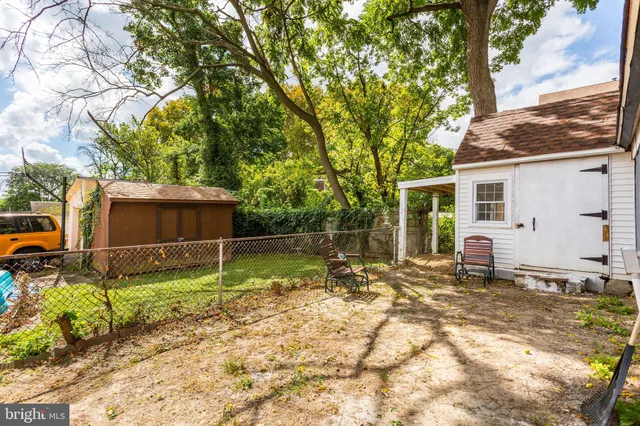 a backyard of a house with trampoline
