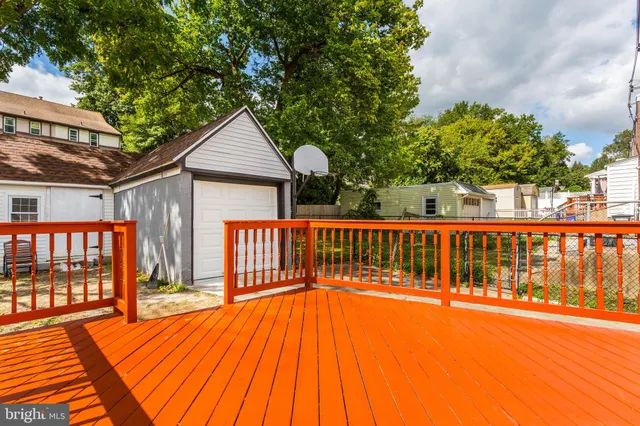 a view of backyard with a deck and wooden floor