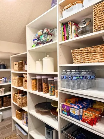 a bathroom with a granite countertop toilet and sink