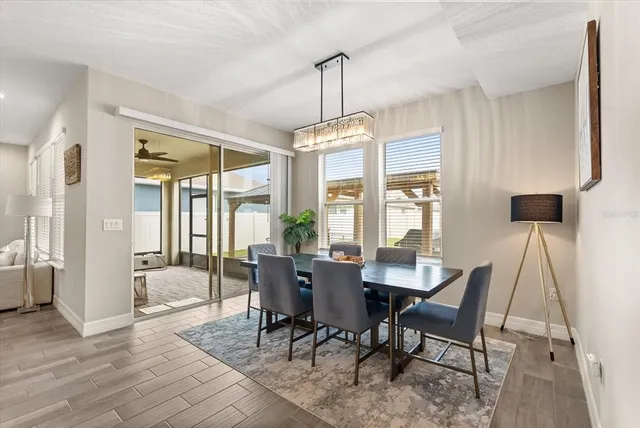 a open kitchen with stainless steel appliances granite countertop a stove and a wooden floors