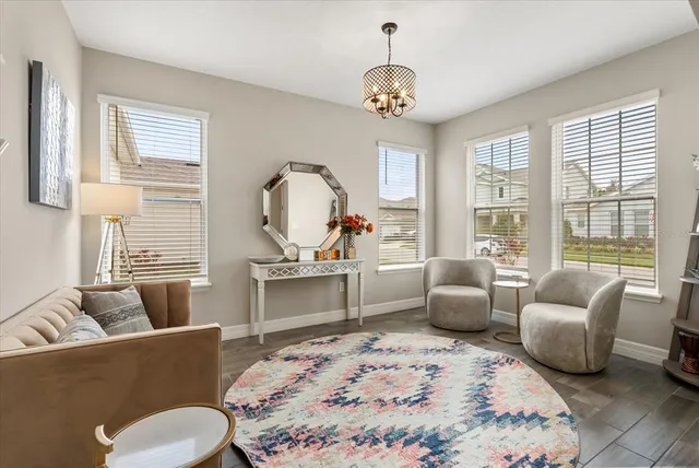 a bedroom with furniture and a window