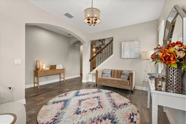a living room with chairs
