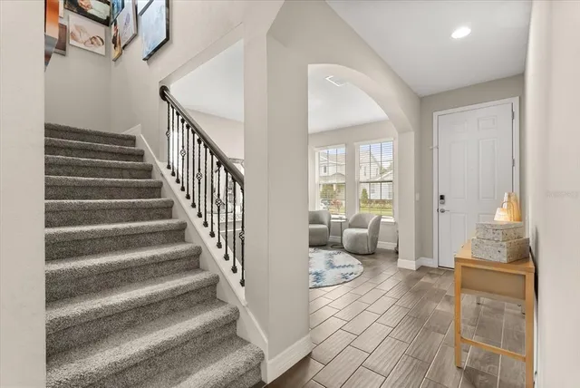 a bedroom with a bed and a table in it