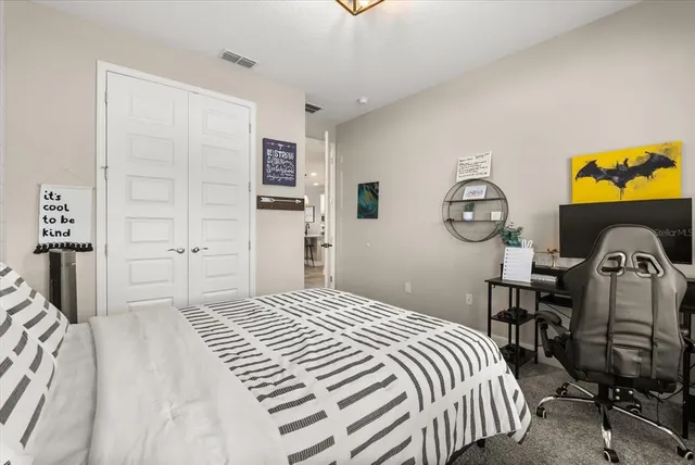 a bathroom with a granite countertop sink toilet and a mirror