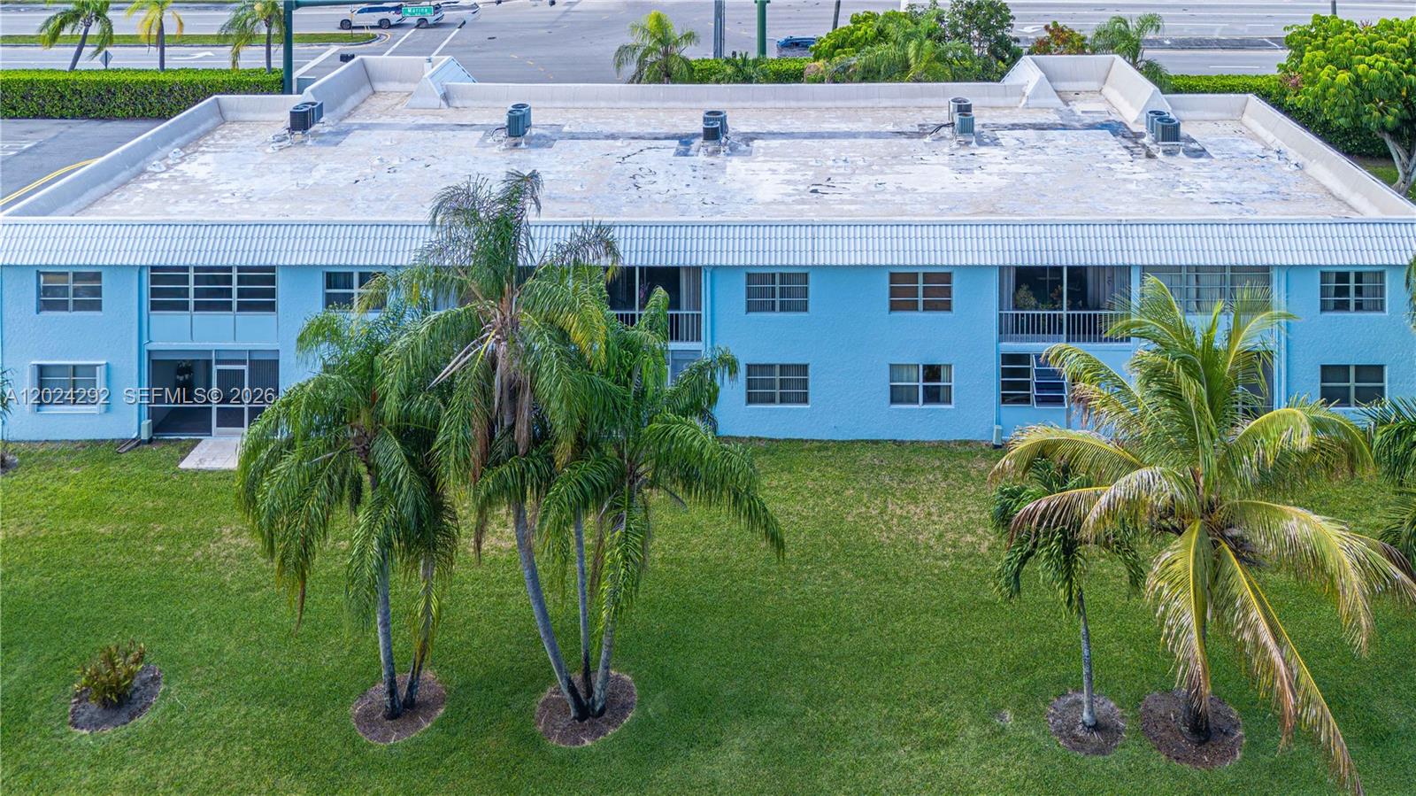 9780 Marina Boulevard, Unit 424 Boca Raton, FL 33428 - Photo 24 of 32 a view of a yard in front of house