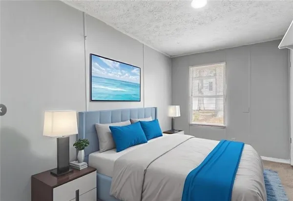 a bedroom with a bed and a lamp next to a window