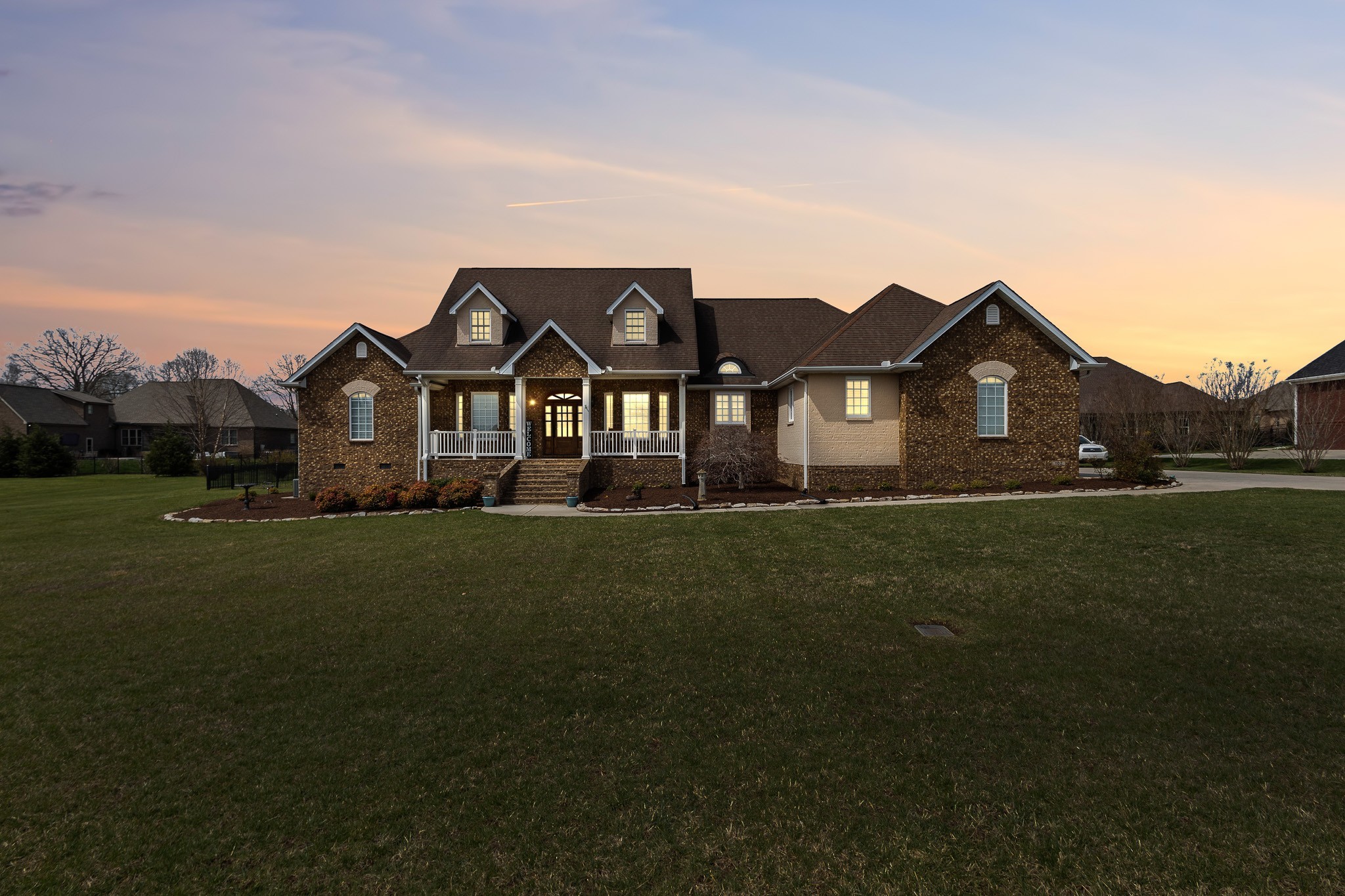 102 Highpoint Boulevard Tullahoma, TN 37388 - Photo 1 of 49 a front view of a house with a garden
