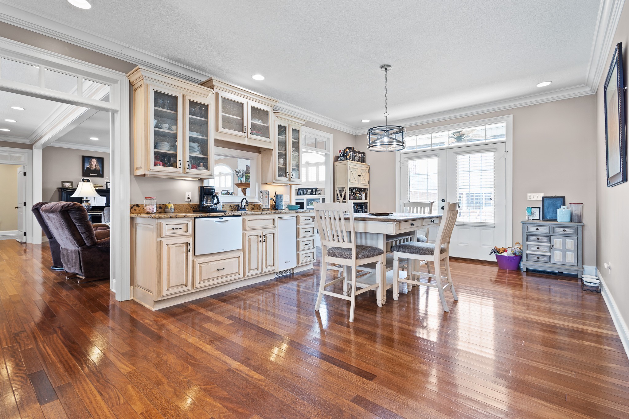 102 Highpoint Boulevard Tullahoma, TN 37388 - Photo 12 of 49 a kitchen with stainless steel appliances granite countertop a stove top oven a sink a dining table and chairs