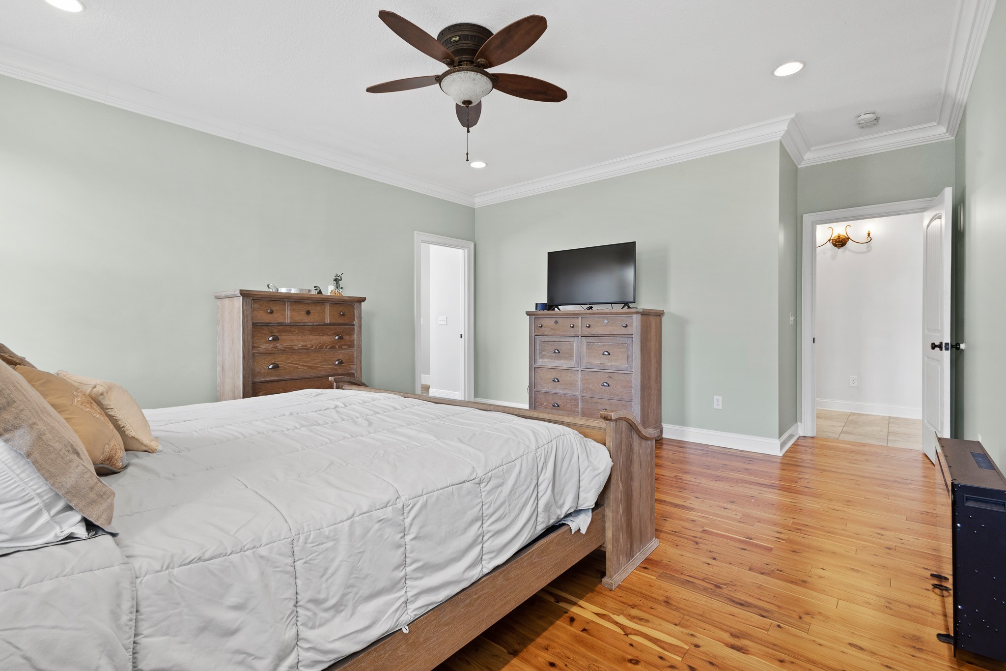 102 Highpoint Boulevard Tullahoma, TN 37388 - Photo 15 of 49 a bedroom with a bed and a chandelier