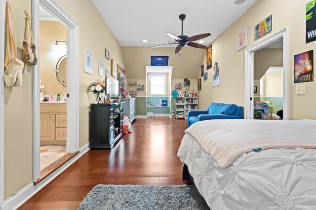 a bed room with a bed and wooden floor