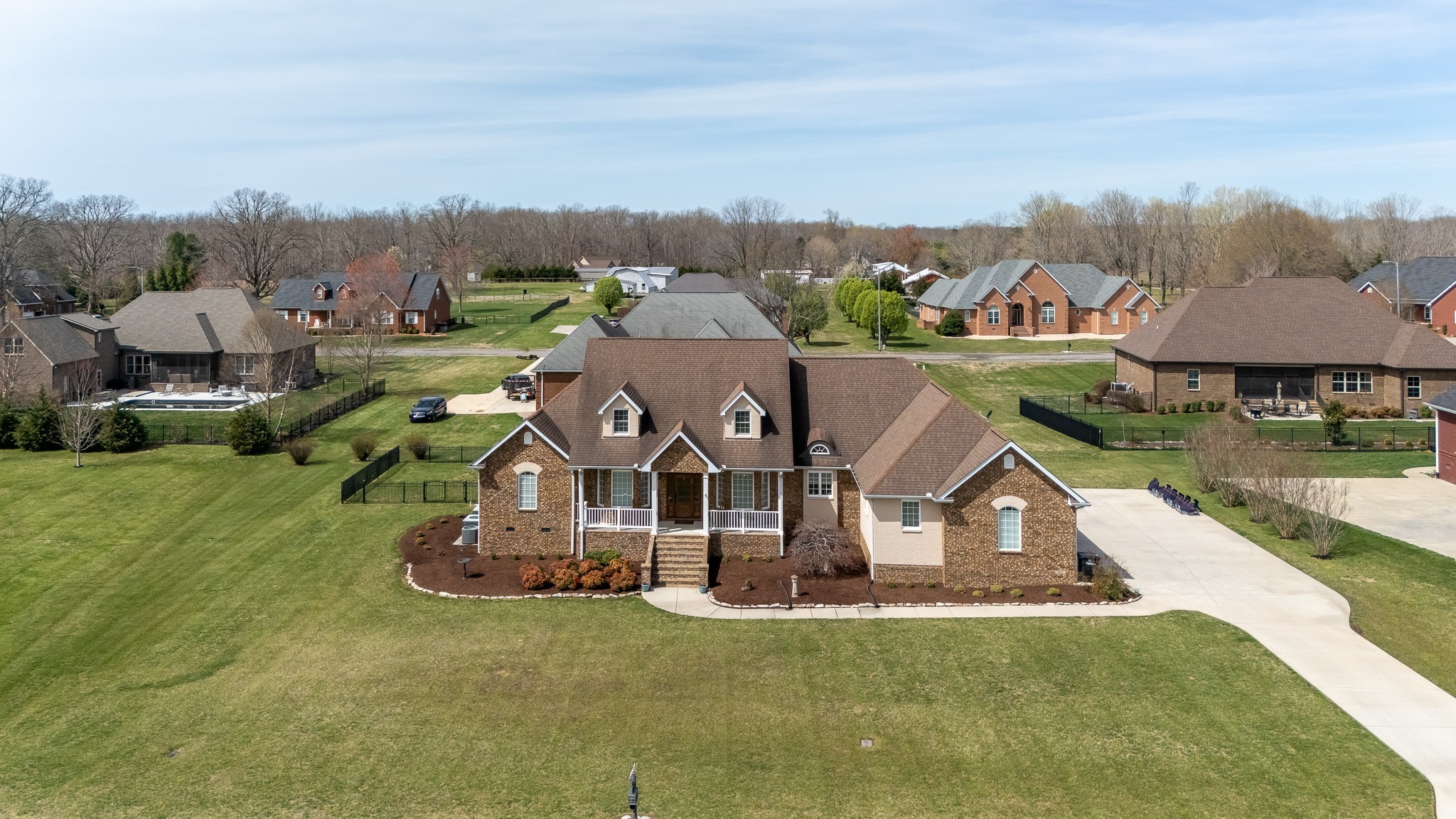 102 Highpoint Boulevard Tullahoma, TN 37388 - Photo 36 of 49 an aerial view of a house with a garden and lake view