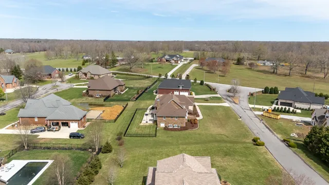 an aerial view of a house with outdoor space